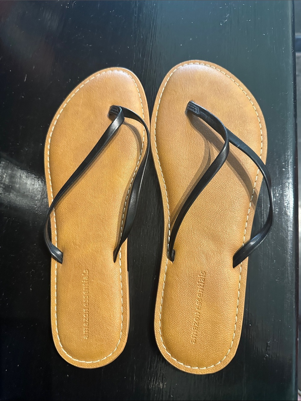 Amazon Essentials Women's Tan Footbed Flip Flops with Black Straps